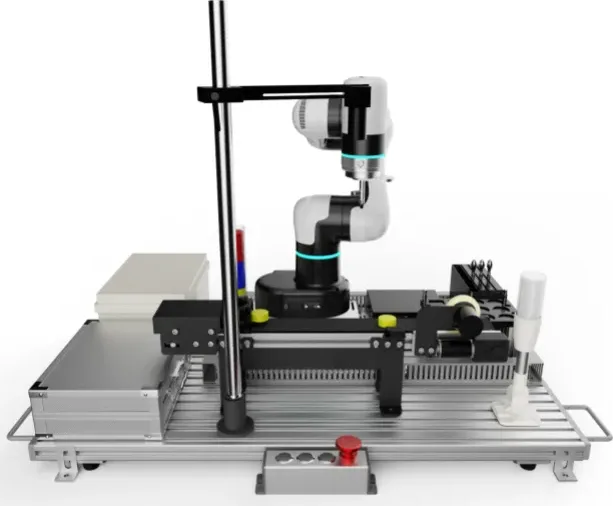 A training bench: a cobot on an aluminium frame with tooling stations along the deck