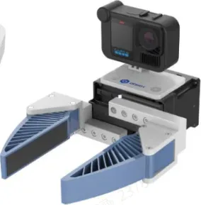 A handheld rig: a camera mounted above a pair of finned grippers